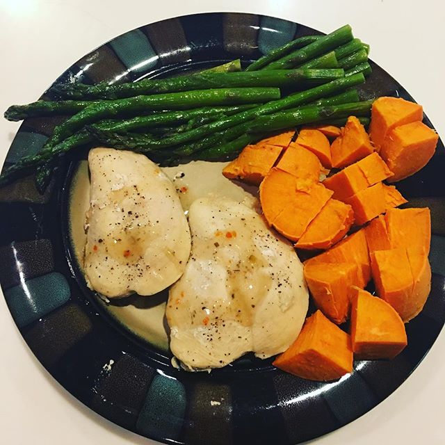 Chicken breast drizzled in lite Italian, sweet potatoes and asparagus. #cleaneating #drecipes