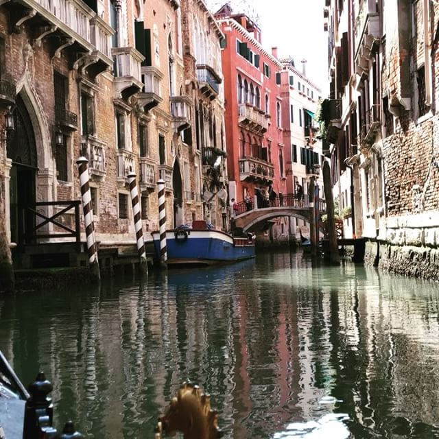 Slow row down the canals of Venice.