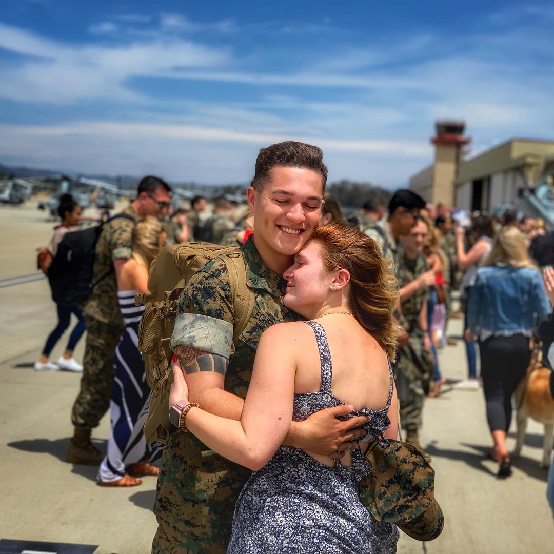 Together again. Welcome home, Marine!